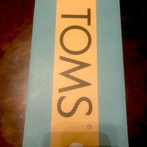 Silver iridescent glimmer Toms shoes for youth girls.